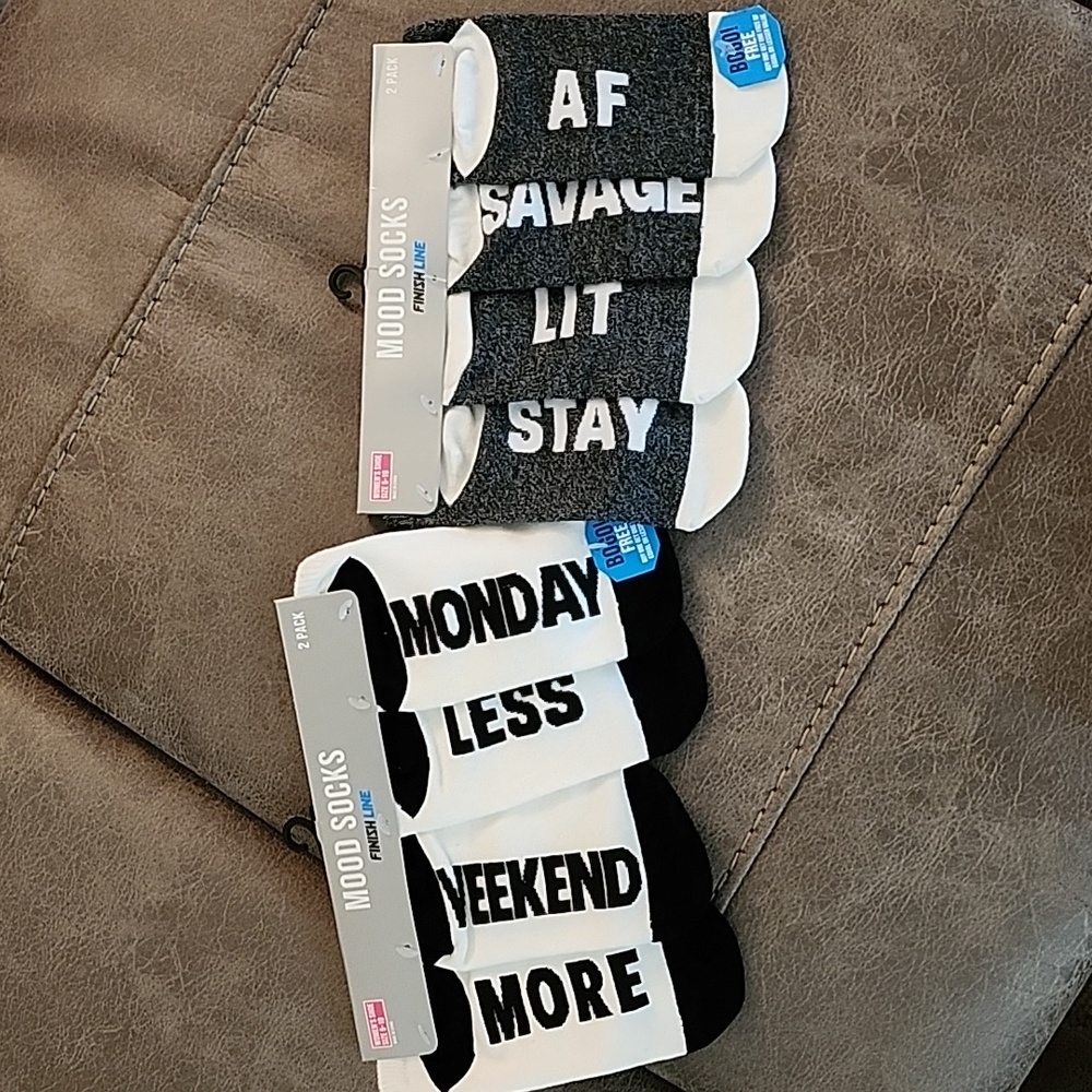 2 packs, 2 pairs each. one is gray and white/ other is black and white